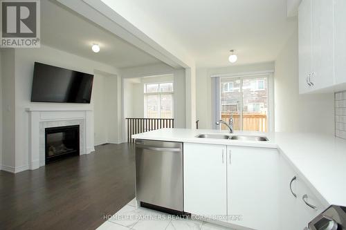 80 Coho Drive, Whitby, ON - Indoor Photo Showing Kitchen With Fireplace With Double Sink