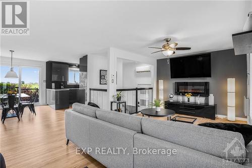 1699 Bay Road, Champlain, ON - Indoor Photo Showing Living Room With Fireplace