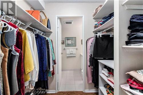 walk in closet in primary bedroom leading to the 2 piece ensuite bath - 141 Somerset Street Unit#601, Ottawa, ON - Indoor With Storage