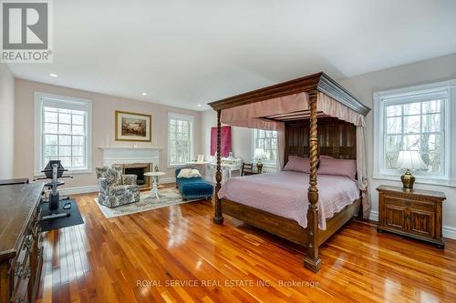 582 Wilson Line, Cavan Monaghan, ON - Indoor Photo Showing Bedroom With Fireplace