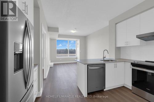 310 - 3220 William Coltson Avenue, Oakville, ON - Indoor Photo Showing Kitchen With Upgraded Kitchen