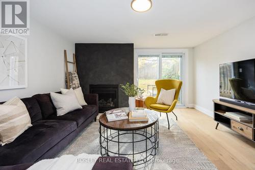 104 Dutch Myrtle Way, Toronto, ON - Indoor Photo Showing Living Room With Fireplace