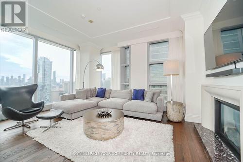 3903 - 183 Wellington Street W, Toronto, ON - Indoor Photo Showing Living Room With Fireplace