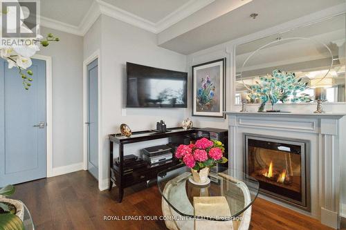 Lph08 - 55 Speers Road, Oakville, ON - Indoor Photo Showing Living Room With Fireplace