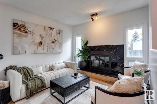 #50 15710 Beaumaris Rd Nw, Edmonton, AB - Indoor Photo Showing Living Room With Fireplace