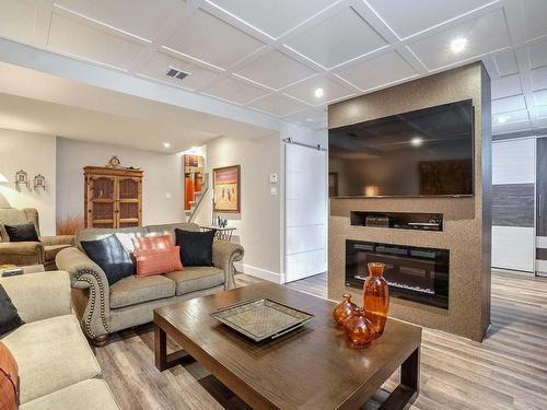 Salle familiale - 1031 Rue Gérard-Cloutier, Prévost, QC - Indoor Photo Showing Living Room With Fireplace