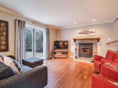 Salon - 1031 Rue Gérard-Cloutier, Prévost, QC - Indoor Photo Showing Living Room With Fireplace