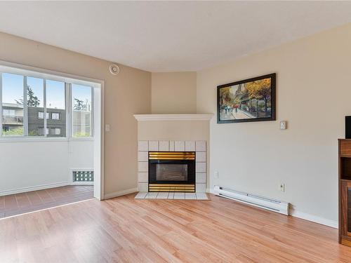 307-2900 Orillia St, Saanich, BC - Indoor Photo Showing Living Room With Fireplace