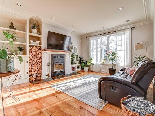 Living room - 214 Rue Jean-Pierre, Sainte-Sophie, QC - Indoor Photo Showing Living Room With Fireplace