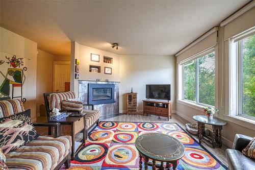 7-4404 Pleasant Valley Road, Vernon, BC - Indoor Photo Showing Living Room With Fireplace