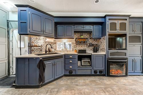 5974 Farmers Drive, Kelowna, BC - Indoor Photo Showing Kitchen With Double Sink