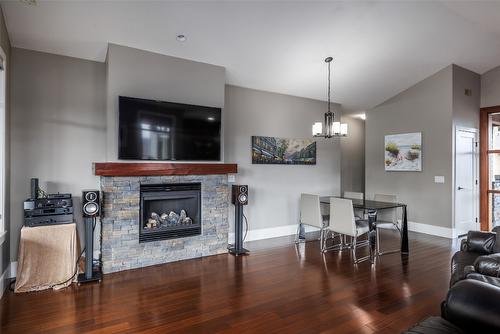 203-4000 Redstone Crescent, Peachland, BC - Indoor Photo Showing Living Room With Fireplace