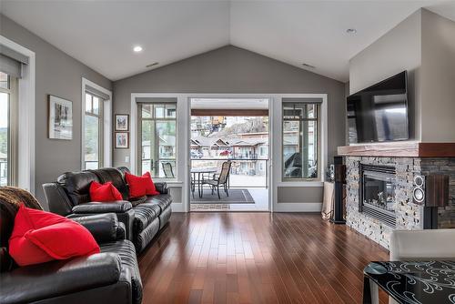 203-4000 Redstone Crescent, Peachland, BC - Indoor Photo Showing Living Room With Fireplace