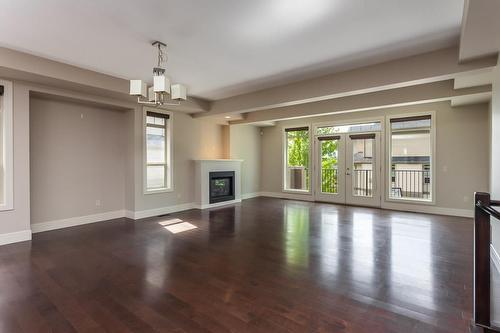 4-1865 Begbie Road, Kelowna, BC - Indoor Photo Showing Living Room With Fireplace