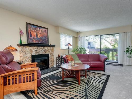 24-3958 Cedar Hill Rd, Saanich, BC - Indoor Photo Showing Living Room With Fireplace