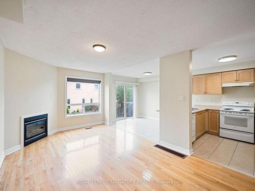 4909 James Austin Dr, Mississauga, ON - Indoor Photo Showing Kitchen With Fireplace