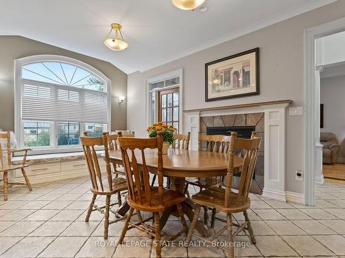 48 Tuscani Dr, Hamilton, ON - Indoor Photo Showing Dining Room With Fireplace