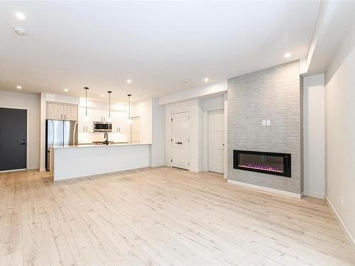 504-958 Pharoah Mews, Langford, BC - Indoor Photo Showing Living Room With Fireplace