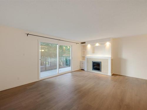 208-1024 Fairfield Rd, Victoria, BC - Indoor Photo Showing Living Room With Fireplace