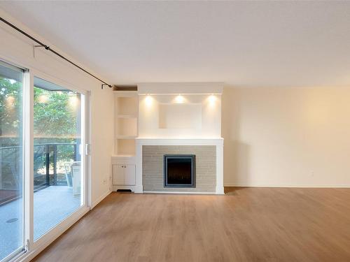 208-1024 Fairfield Rd, Victoria, BC - Indoor Photo Showing Living Room With Fireplace