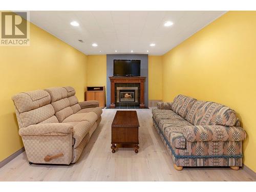 1080 Calmels Crescent, Kelowna, BC - Indoor With Fireplace