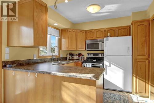 82 Mcsherry Crescent, Regina, SK - Indoor Photo Showing Kitchen With Double Sink