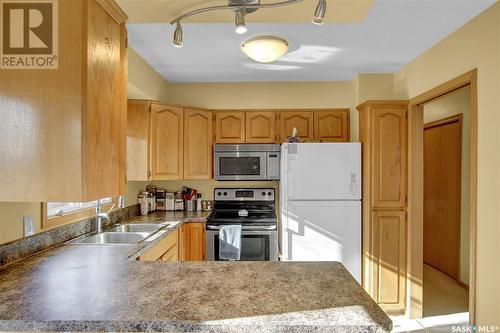 82 Mcsherry Crescent, Regina, SK - Indoor Photo Showing Kitchen With Double Sink