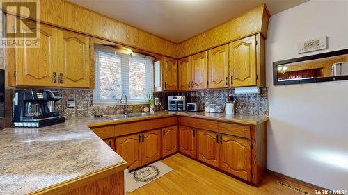 335 Argyle Street N, Regina, SK - Indoor Photo Showing Kitchen With Double Sink