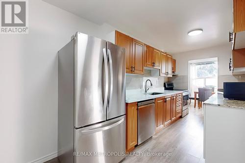 106 - 4060 Lawrence Avenue E, Toronto, ON - Indoor Photo Showing Kitchen With Stainless Steel Kitchen