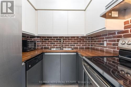 304 - 21 George Street, Aurora, ON - Indoor Photo Showing Kitchen With Double Sink