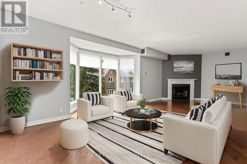 304 - 21 George Street, Aurora, ON - Indoor Photo Showing Living Room With Fireplace