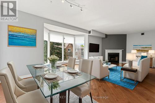 304 - 21 George Street, Aurora, ON - Indoor Photo Showing Dining Room With Fireplace