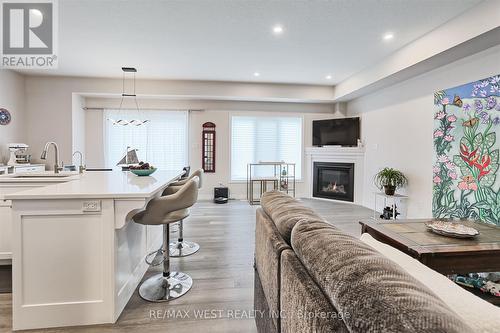 80 Mill Race Crescent, Woolwich, ON - Indoor Photo Showing Other Room With Fireplace