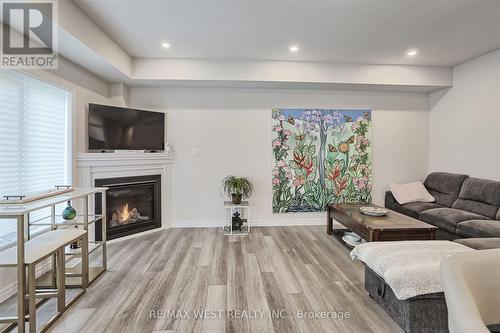 80 Mill Race Crescent, Woolwich, ON - Indoor Photo Showing Living Room With Fireplace