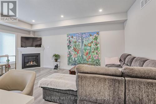 80 Mill Race Crescent, Woolwich, ON - Indoor Photo Showing Living Room With Fireplace