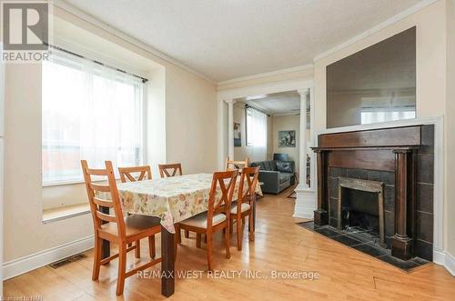 6175 Barker Street, Niagara Falls, ON - Indoor Photo Showing Dining Room With Fireplace