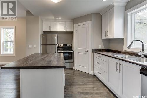 1336 B Avenue N, Saskatoon, SK - Indoor Photo Showing Kitchen With Double Sink