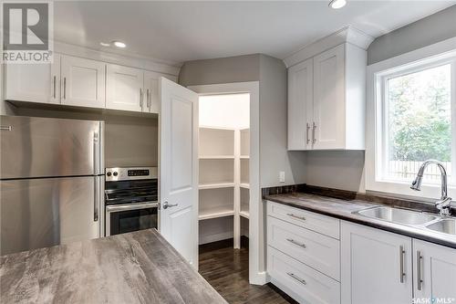 1336 B Avenue N, Saskatoon, SK - Indoor Photo Showing Kitchen With Double Sink