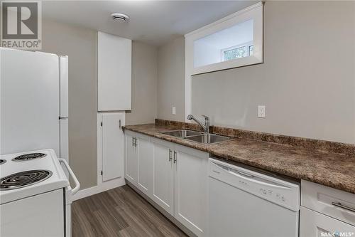 1336 B Avenue N, Saskatoon, SK - Indoor Photo Showing Kitchen With Double Sink