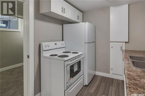 1336 B Avenue N, Saskatoon, SK - Indoor Photo Showing Kitchen With Double Sink