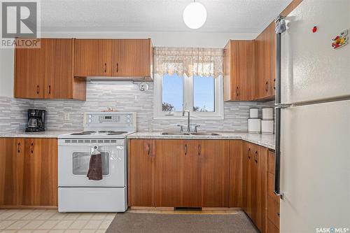 3709 Centennial Drive, Saskatoon, SK - Indoor Photo Showing Kitchen With Double Sink