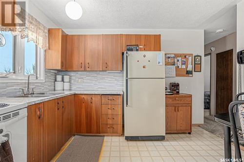 3709 Centennial Drive, Saskatoon, SK - Indoor Photo Showing Kitchen With Double Sink