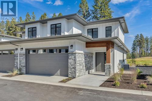 Front exterior - Photo of a similar home in the community. - 1979 Country Club Drive Unit# 7, Kelowna, BC - Outdoor With Facade