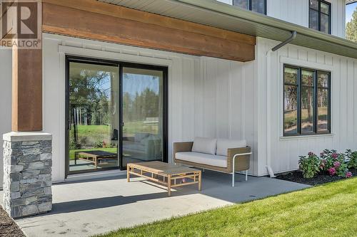 Rear patio - Photo of a similar home in the community. - 1979 Country Club Drive Unit# 7, Kelowna, BC - Outdoor With Deck Patio Veranda With Exterior