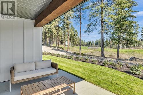 Rear patio - Photo of a similar home in the community. - 1979 Country Club Drive Unit# 7, Kelowna, BC - Outdoor With Deck Patio Veranda