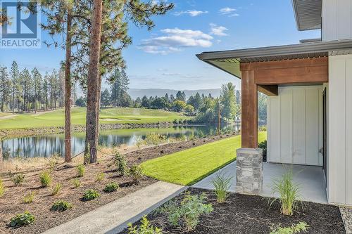 Rear patio - Photo of a similar home in the community. - 1979 Country Club Drive Unit# 7, Kelowna, BC - Outdoor With Body Of Water With View