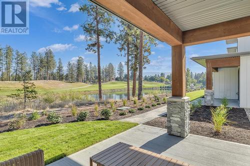 Rear patio - Photo of a similar home in the community. - 1979 Country Club Drive Unit# 7, Kelowna, BC - Outdoor With Deck Patio Veranda With View