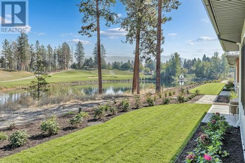 Backyard and view - Photo of a similar home in the community. - 1979 Country Club Drive Unit# 7, Kelowna, BC - Outdoor With View