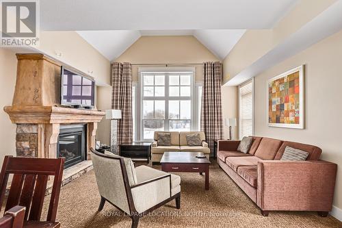 226 - 125 Fairway Court, Blue Mountains, ON - Indoor Photo Showing Living Room With Fireplace