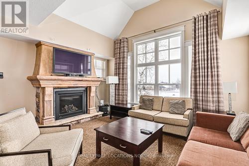 226 - 125 Fairway Court, Blue Mountains, ON - Indoor Photo Showing Living Room With Fireplace